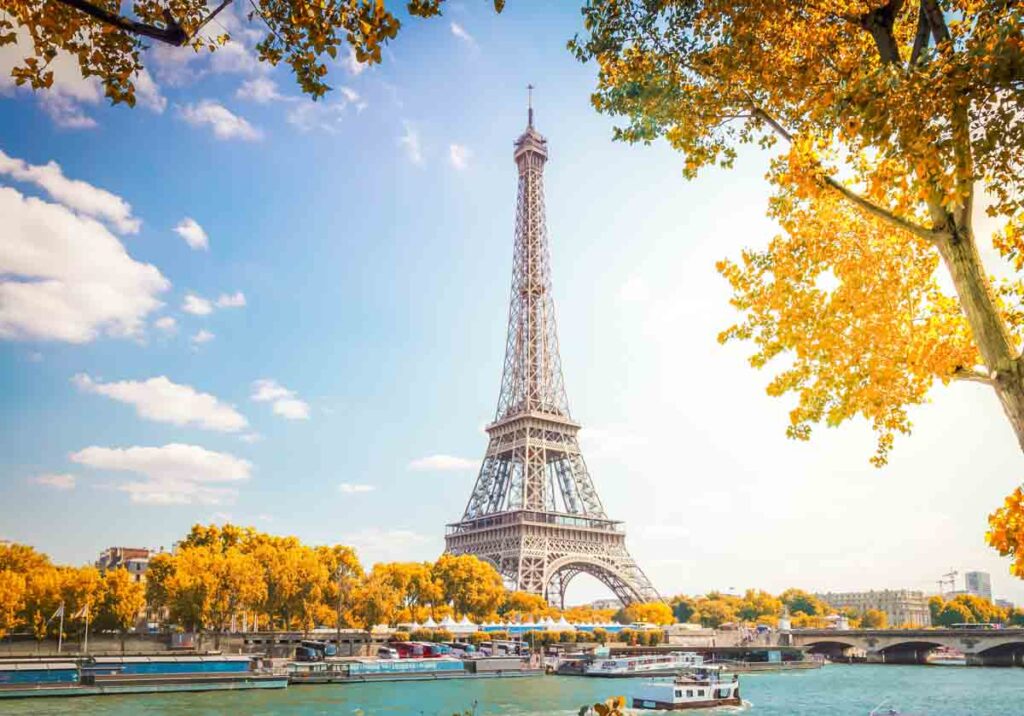 Eiffel tower over Seine river with autumn tree, Paris